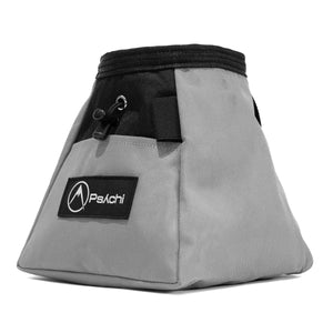 A light grey and black bouldering chalk bucket with drawstring closure and climbing accessory pockets