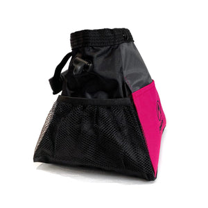 The side pocket of a magenta bouldering chalk bag