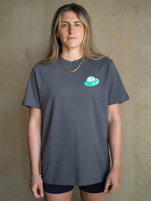 Modern climbing t shirts for bouldering, worn by  female climber in a gym setting.