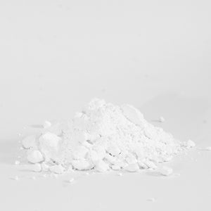 a small pile of rock climbing chalk with fine powder and some small lumps