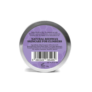 A tin with a purple label wih Lavender beeswax skincare for climbers written in black.