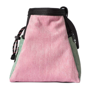 The side profile of a trapezoid shaped psychi bouldering chalk bucket in muted pink and light green corduroy.