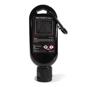 a black bottle containing 50ml of liquid climbing chalk and a carabiner which isn't intended for climbing use.