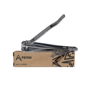 A pair of silver nail clippers on a brown box with psychi climbing shop branding