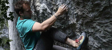 Psychi Ambassador Tom Lloyd climbing a bouldering route at rubicon crag in the peak district