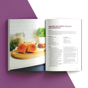 An open cookbook or recipe book laid flat on a stylized white and purple background. The left page shows a food photo of sliced orange squash on a wooden board, and the right page contains the recipe title 'Salmon Butternut Squash and Asian Rice' with ingredients and instructions.