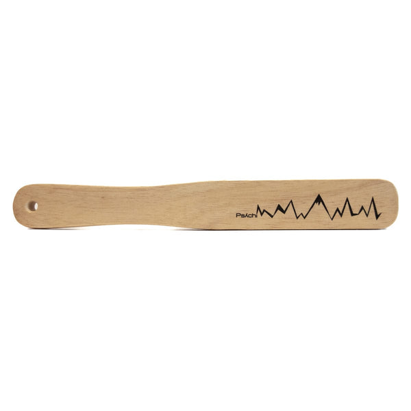 wooden rock climbing brush with black psychi logo