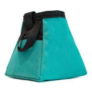 A turquoise and black bouldering chalk bucket with drawstring closure and climbing accessory pockets