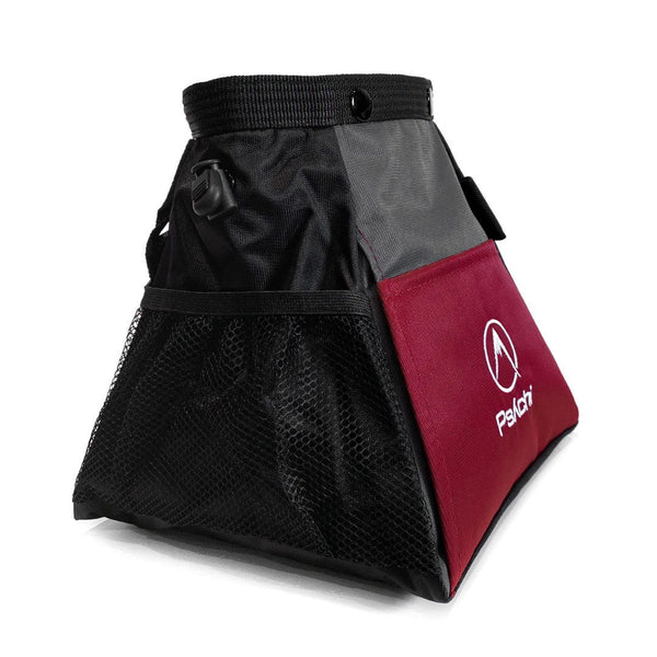 The side pocket of a maroon bouldering chalk bag