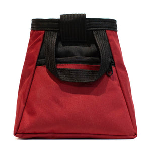 A red bouldering chalk bucket with black carry handle and a zip pocket on a white background