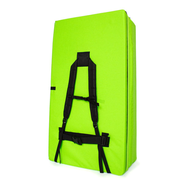 A folded up green bouldering crash pad with shoulder carry straps measuring 60cm x 110cm x 37.5cm