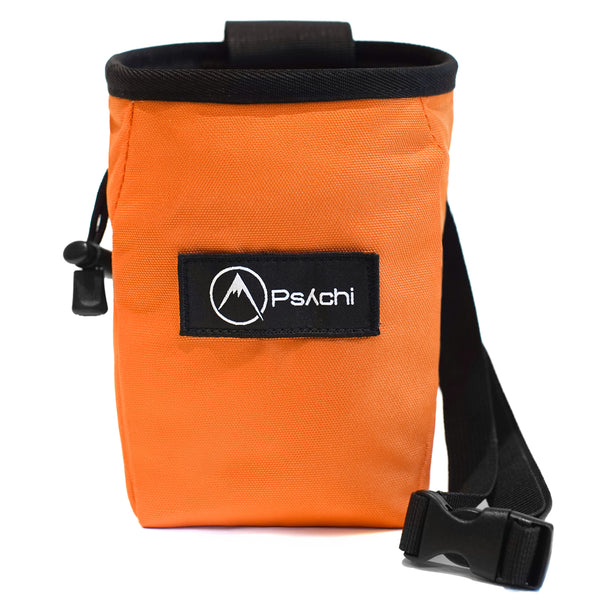 An Orange rock climbing chalk bag with black and white psychi logo