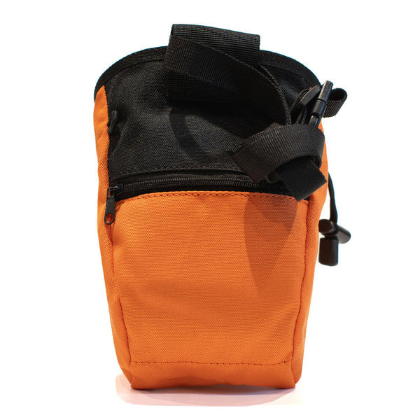 A light orange climbing chalk bag with a zip closure accessory pocket and strong nylon waist strap