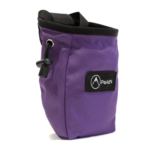 A magenta rock climbing chalk bag with drawstring closure and Pyschi white mountain logo on a black fabric patch