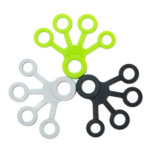 Three finger strengthening tools for climbing in grey, green and black to denote the resistance level of each tool
