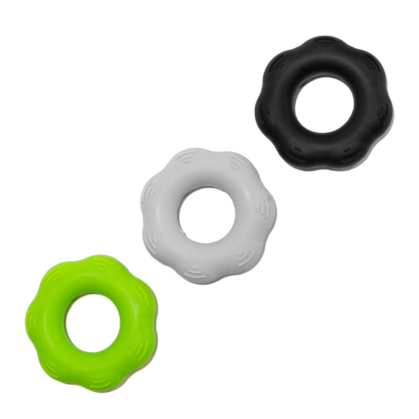 Three climbing resistance grip training rings for climber and bouldering strength training.