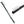 A black plastic dual ended rock climbing brush