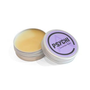 Lavender beeswax skin repair balm in a metal tin with a lid on a white background.