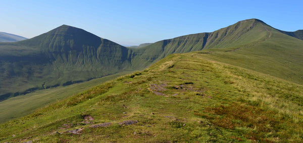 An adventurous winding path in the sun heading up Pen y fan in Wales