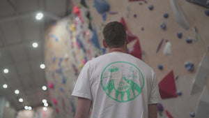 Liquid climbing chalk being used to improve climbers' grip at a climbing gym 