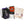 An orange and brown climbing chalk bag and chalk bundle, with climbing shoe bag, wooden brush, chalk ball, t-shirt and purple carabiner