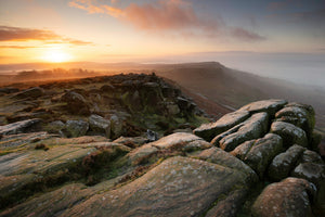 Sunrise over Curbar Edge, a boulder strewn landscape in the peak district.