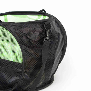 Black mesh bag with shoulder strap and green interior on a white background