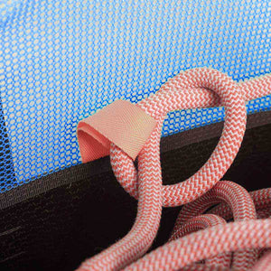 Close-up of a red rope tied to a belay bucket gear loop