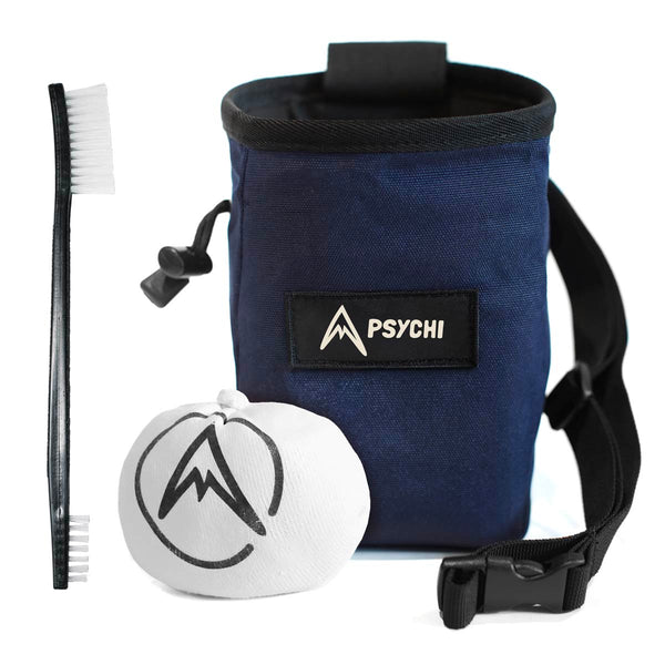 A navy blue climbing chalk bag and chalk for beginner climbers and bouldering. Includes chalk bag, brush and chalk ball.