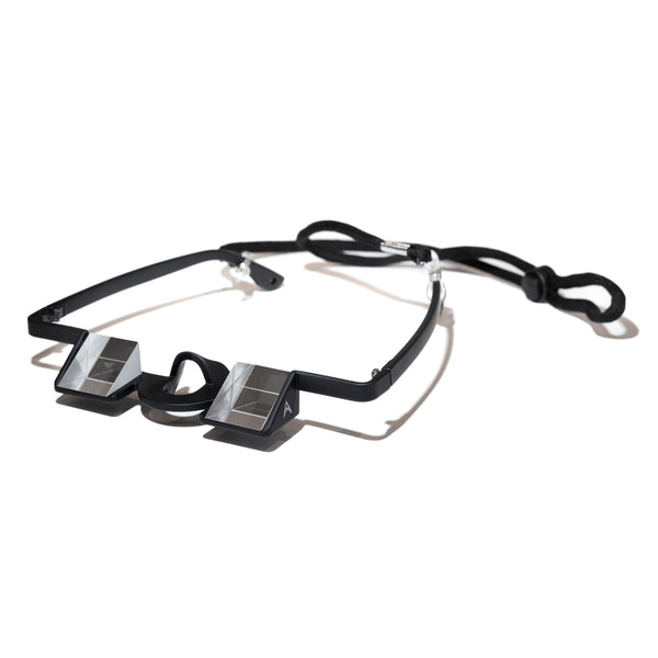 A black pair of rock climbing belay glasses with neck strap and grey psychi climbing shop logo