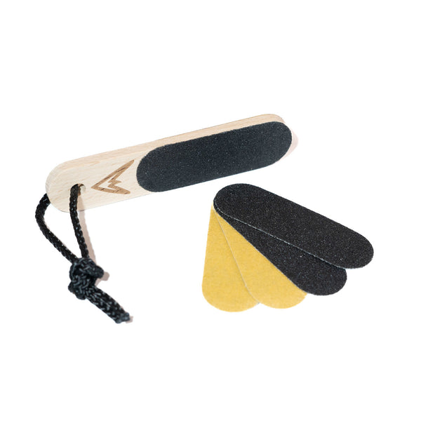 A wooden finger skin file for climbers with a black rope attachment and 4 spare sandpaper swatches