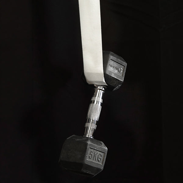 A 5 kilogram dumb bell hangs from a length of white cotton climbing sports tape