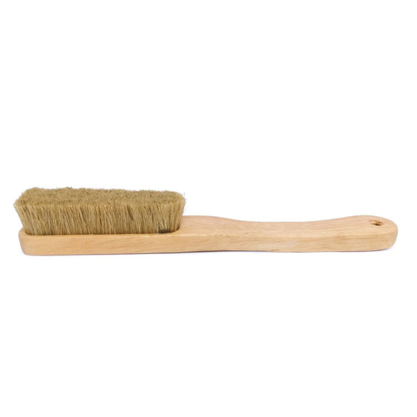 A wooden brush with boar hair bristles.