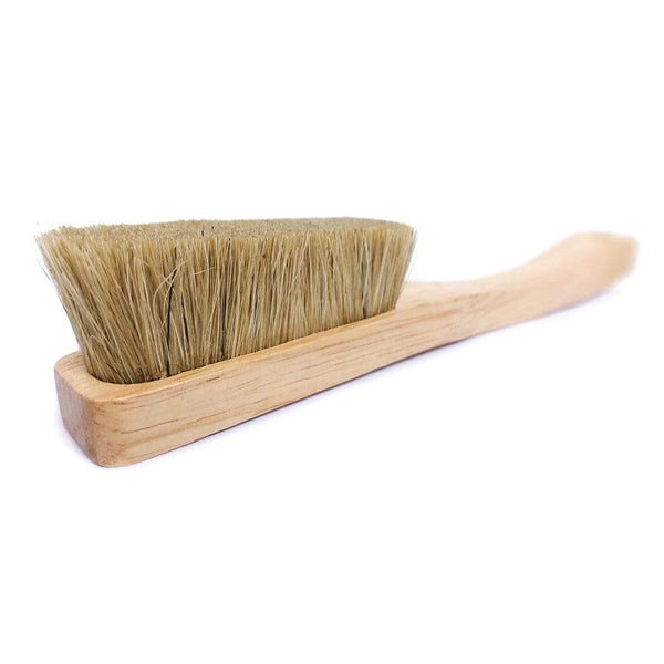 A wooden brush with boar hair bristles.