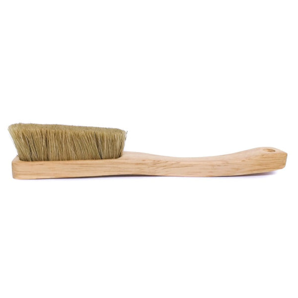 A wooden brush with boar hair bristles.