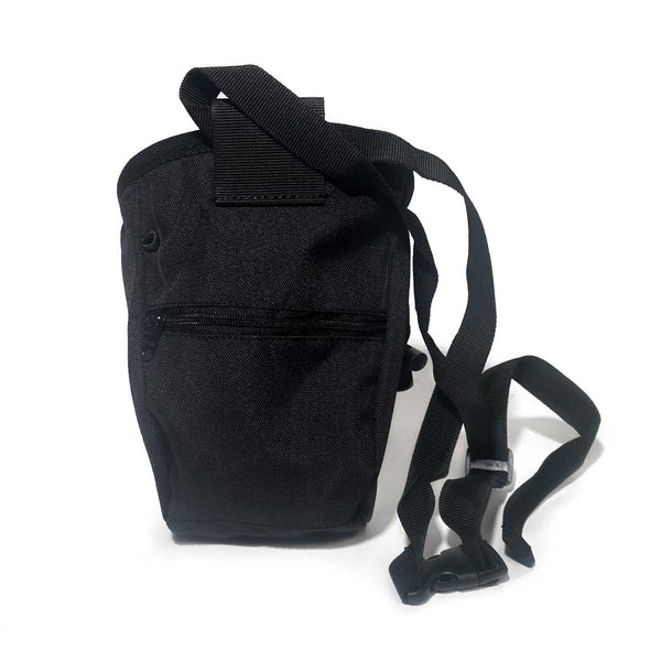 Rear of black chalk bag with zipped pocket, a black waist strap and a black drawstring closure