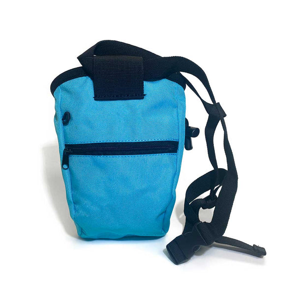 Rear of blue fun chalk bag with zipped pocket, a black waist strap and a black drawstring closure. 