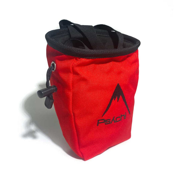 Red chalk bag with black mountain logo, a black waist strap and a black drawstring closure.