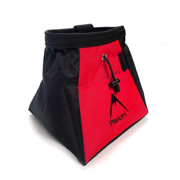 A red and black bucket bag, with black mountain psychi logo, front pocket, a wide base, brush holder and a drawstring closure.