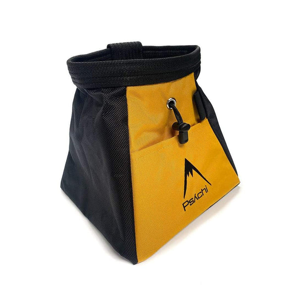 A yellow and black bucket bag, with black mountain psychi logo, front pocket, a wide base, brush holder and a drawstring closure.